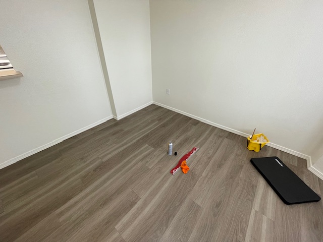 Property maintenance for local rental property – floor trim - corner of dining room