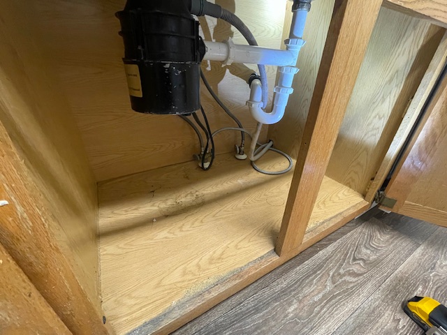 Bottom sink cabinet replacement due to water damage rental property